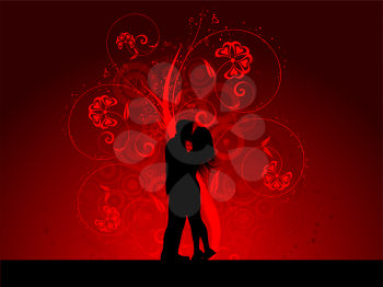 Silhouette of a kissing couple on a decorative background