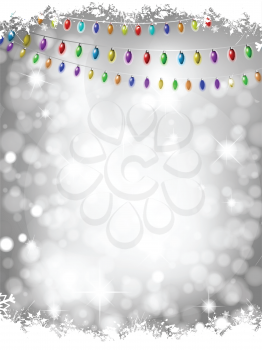 Christmas lights on a silver bokeh lights background with snow