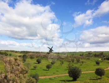 Royalty Free Photo of a Windmill in a Field