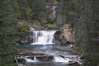 Magnificent cascade falls in park Johnson in the north of Canada