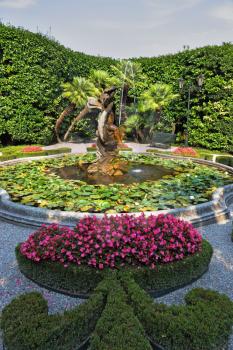 Magnificent park with fountains, statues, flower beds. Lake Como, Villa Carlotta
