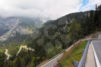 Italy, Dolomites. The magnificent mountain valley. Winding and dangerous road - the Serpentine. Photo taken by lens Fisheye