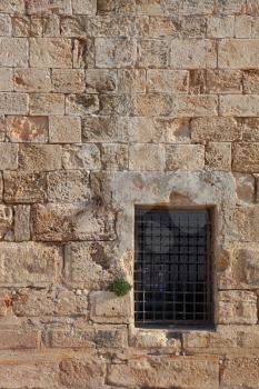 An ancient Crusader fortress. The window closed by a lattice