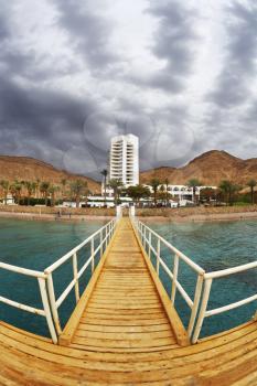 The wooden pier on beach of Red sea in Eilat 