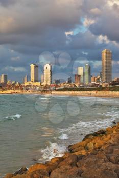 Celebratory quay in Tel Aviv. The fluffy clouds shined with the sunset sun.
