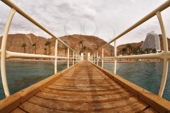 Wooden pier on a beach of Red sea in Eilat