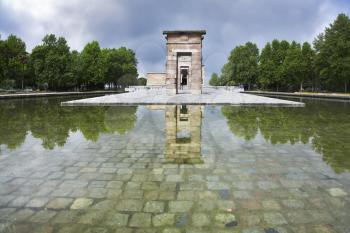 The pond paved by a grey stone near to Egyptian temple Debod in Madrid