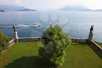 Terrace, adorned with sculptures, on the embankment. Park on the island of Isola Bella on Lake Maggiore