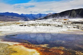 Hot fog above geothermal springs and lakes in Yellowstone national Park