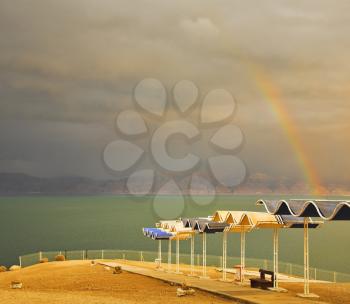 Magnificent rainbow during a spring thunder-storm on the Dead Sea
