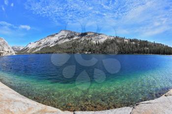 The majestic American nature. Blue shallow lake in a hollow among the mountains. Photo taken fisheye lens