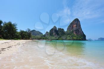  White sand on a beach and rocks. Charming resort landscape in Thailand, Krabi