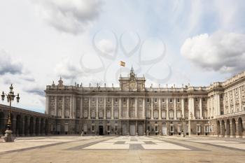 The magnificent Royal Palace in Madrid. The huge square in front of the castle and the lights in the Baroque style