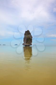 Cloudy morning in Gulf of Thailand. Magnificent island Sail Rock floats in a fog

