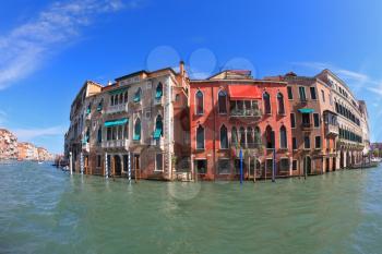 Magnificent Venetian palace on a sunny day, surrounded by the waters of the channel mirror. Photo making the lens Fisheye