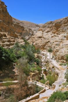 The bridge on a mountain road going to the temple - the Monastery of St. George the Victorious. Wadi Kelt near Jerusalem.