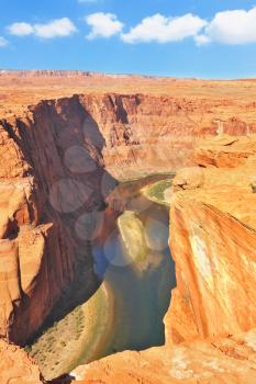 The well-known river Colorado is picturesquely bent in the Horseshoe. The high and abrupt coast dangerously breaks over green water of the river