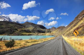 The National Park Torres del Paine in Chile. The dirt road along the shore of Lake Pehoe
