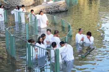 Yardenit, Israel - January 21: Christian pilgrims ritual baptism in the waters of the Jordan River in the days of the Feast of Holy Baptism 21 January 2012 at Pilgrim baptismal site Yardenit, Israel. 