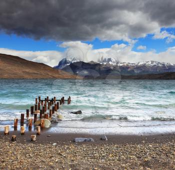  Storm clouds and strong winds in Laguna Azul. Boat dock on the lake. National Park Torres del Paine in Patagonia, Chile