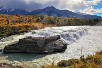 The majestic cascading waterfall. National Park Torres del Paine in southern Chile, Patagonia