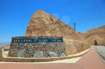 Highway built in the valley of the Dead Sea in Israel. On the side of a highway sign Sea Level