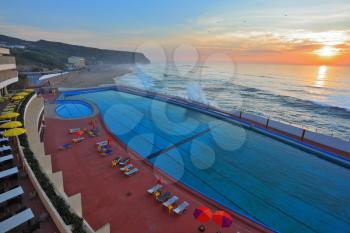 The picturesque coast of the Atlantic. The magnificent swimming pool on the beach in Sintra, Portugal