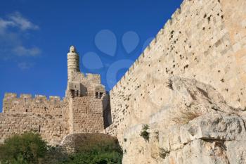 The ancient walls of the eternal Jerusalem and the Tower of David. Beautiful sunset