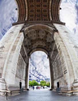 The striking and unexpected angle Arc de Triomphe in Paris. Background - the cloudy sky. Photo was taken Fisheye lens
