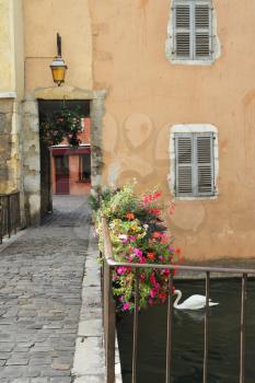The ancient city in the south of France - Annecy. Canal, bridge and suite of transitions in the houses on the waterfront