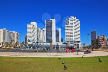 TEL AVIV, ISRAEL - MAY 2, 2014: Beautiful Tel Aviv promenade. On the green lawn in front of the hotel playground attraction