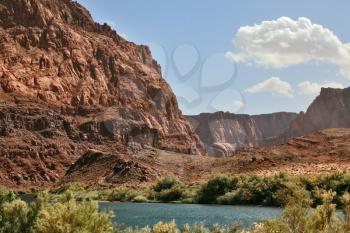 Magnificent Colorado River water is cold in the steep banks of red sandstone. Navajo Reservation, USA