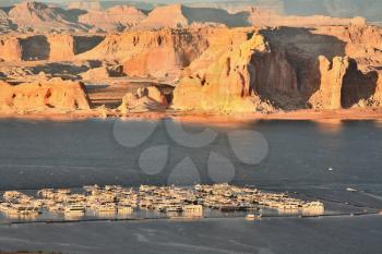 Fantastically beautiful landscape. Lake Powell sunset. Boats in the lake port