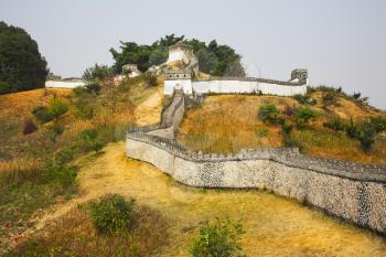 The reduced copy of the Great Chinese wall in the Chinese park of entertainments