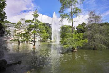 The well-known Crystal palace, lake and fountain in Madrid park Buen-Retiro