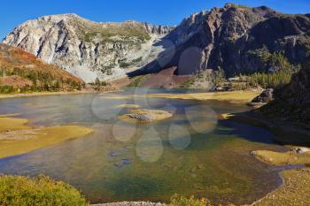 Picturesque shallow lake on pass Tioga in Yosemite park in the USA. Autumn midday