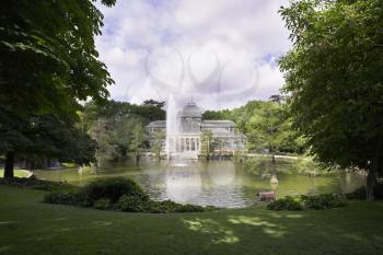 The well-known Crystal palace, lake and fountain in Madrid park Buen-Retiro