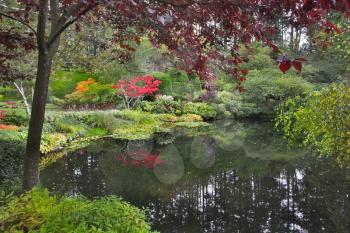  Lake and trees in well-known gardens Butchart Gardens on island Vancouver