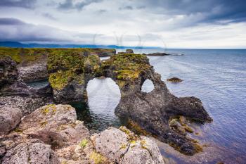  July day in Iceland. Magical coastal cliffs fishing village Arnastapi