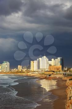Promenade and beach in Tel Aviv. Thundercloud closed sky