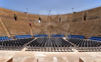  An amphitheater of the period of the Roman invasion in national park Caesarea on Mediterranean sea