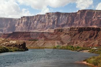  A reservation of Indians of the Navajo, the USA. Magnificent cold water the river Colorado in abrupt coast from red sandstone