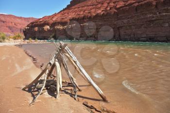 Indian ritual construction of poles on the sandy beach of the Colorado River