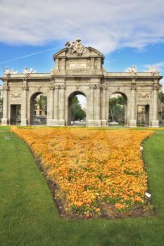 Superb Spain. Arc de Triomphe and a huge flower bed in Madrid