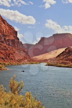 A small tourist boat in the turbulent flow of the Colorado River