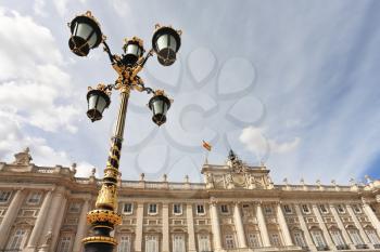 The magnificent Royal Palace in Madrid. Lanterns in the Baroque style adorn the Palace 