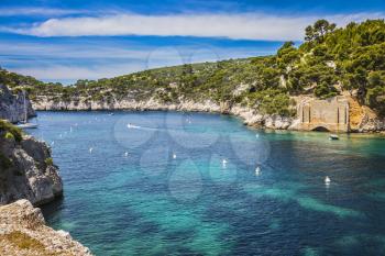   Provence, France, spring. Abrupt stony coast and turquoise sea surface. Famous National Park Calanques on the Mediterranean coast