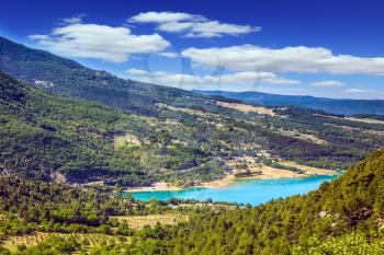 Magnificent lake with emerald water among wooded hills. Canyon of Verdon, Provence, May