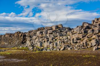  Iceland, Jokulsargljufur National Park. Huge stones on the plateau near a waterfall Dettifoss