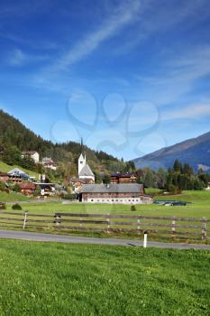 Picturesque houses in green valley. Charming Austrian province